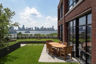 The apartment comes with a 1,500-square-foot landscaped terrace with stunning views of the city, along with two smaller patios (one off the master bedroom). 