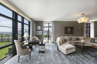 The enormous corner living room boasts stunning Hudson River views.