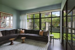 Currently being used as a den, this ground-floor room with terrace access could also be easily transformed into a fourth bedroom.