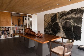 The classic midcentury design is a natural setting for the owner's extensive art collection. 
