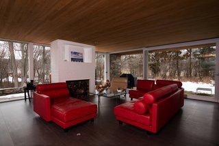 Walls of glass provide panoramic views of the surrounding nature. 