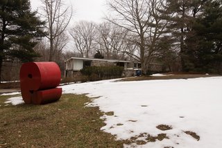 The current owner's sculpture collection dots the property. 