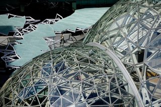 Design computation helped to generate the spheres, each a pentagonal hexecontahedron formed by tessellating a pentagon across its surface. Algorithms enabled the team to quickly generate a steel-and-glass structure that could be constructed efficiently and cost-effectively.