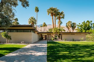 A Luminous Palm Springs Midcentury Asks $3.35M - Photo 1 of 16 - Set back from the street, this private property has sliders with outdoor access, solar panels, and mountain views from every room. 
