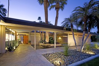 A Luminous Palm Springs Midcentury Asks $3.35M - Photo 2 of 16 - An elegant fountain spills into a palm-sheltered pond at the entry.