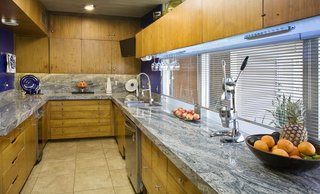 A Luminous Palm Springs Midcentury Asks $3.35M - Photo 9 of 16 - The open kitchen is adjacent to the dining area. 