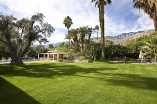 A Luminous Palm Springs Midcentury Asks $3.35M - Photo 14 of 16 - The expansive grassy lawn features several ponds, fountains, native greenery, and even a tea house. 