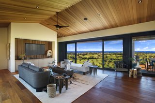 A Breezy Hawaiian Residence by Olson Kundig Hits the Market at $6.95M - Photo 3 of 14 - High ceilings with ceiling fans in the great room makes for bright and breezy interiors.