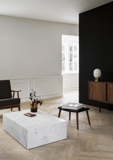 The ground floor of the home was restored from its original configuration of small divided rooms into one spacious living area, and is now surrounded by windows on all sides.