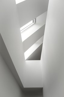 Skylights flood the staircase in natural daylight and increases the sense of height in the house. 