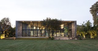 The roof is continuous and rests on top of the structural stone walls. 