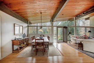 Own an Iconic Midcentury in New Canaan For $1.55M - Photo 3 of 12 - The open-plan living area allows for multiple configurations. 