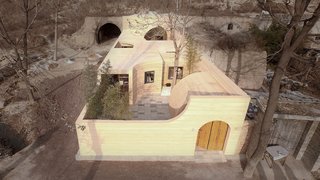 In front of the cave entrance is a new semi-curved canopy that is used to prevent the strong wind from Northwestern Mongolia. 
