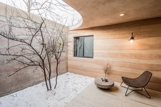 The serene atmosphere channels the tranquility of a traditional Chinese garden. 