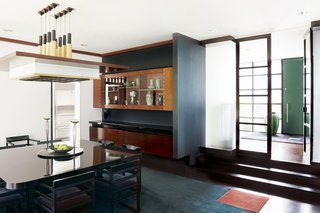 A few steps lead down to a formal dining area. 