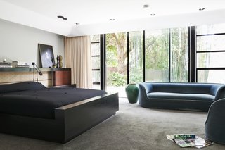 The master bedroom has its own private wing overlooking a garden. 