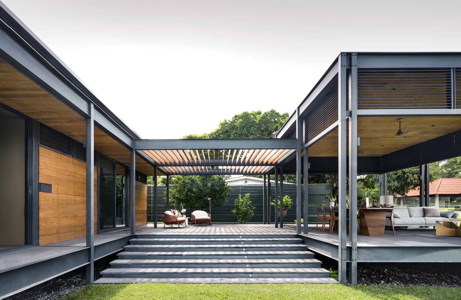 Photo 3 Of 10 In This Modern Prefab Is Now A Gorgeous Guest House Exterior House Building Type Wood Siding Material Prefab Flat Roofline