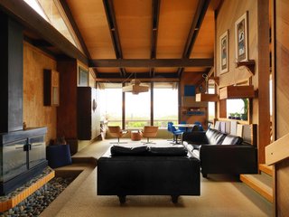 A Contemporary Beach Retreat on California's Central Coast Asks $2.3M - Photo 1 of 10 - The living room features ample glazing and an exposed beam ceiling. 