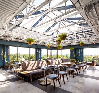  The dining area enjoys elevated panoramic views of the city. 