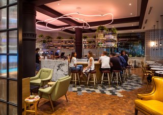 Both the cafe and bar were envisioned to serve as a social hub for hotel guests, as well as the surrounding community. 