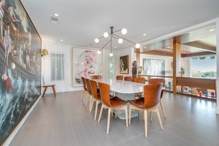 The dining area overlooks the sunken living room and benefits from natural light. 