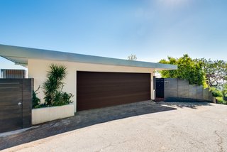 The facade offers a classic, streamlined midcentury profile. The property has been fully updated and is a Full Creston smart home. 
