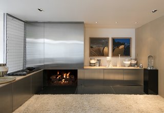 The living room includes a fireplace and hidden wet bar.