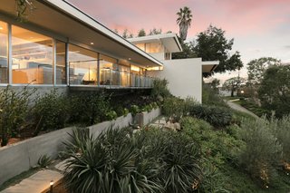 The home is bathed in natural light, thanks to walls of glass on both sides. 
