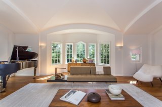Moby Lists His Newly Renovated Los Feliz Manor For $4.5M - Photo 2 of 19 - The home's character has maintained intact by preserving beautiful 1920s details, such as the wood-burning fireplace and the vaulted ceilings shown above in the living room.