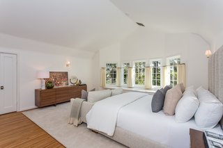 Moby Lists His Newly Renovated Los Feliz Manor For $4.5M - Photo 15 of 19 - This bright bedroom has an ensuite bath and a wood-burning fireplace. 