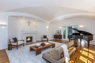 Moby Lists His Newly Renovated Los Feliz Manor For $4.5M - Photo 3 of 19 - Thanks to the vaulted ceilings and expansive windows, the living room feels extremely spacious, making it a great area for entertaining.