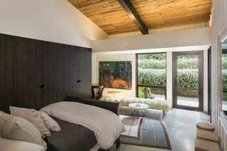 This bedroom opens to a lovely outdoor terrace. 