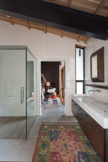 An ensuite bathroom is shared by two of the bedrooms.