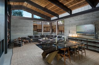 The tongue-and-groove cedar ceiling is an authentic midcentury touch, while clerestory windows help keep the living area bright and airy. 