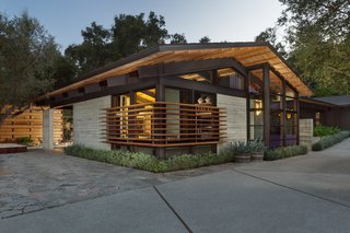 The main house channels a midcentury, modern vibe. 