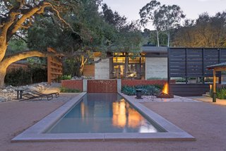 The courtyard in the center of the compound opens to a lovely lap pool and connects the main house to the pool/guest house. 