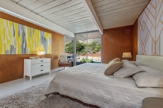The master bedroom overlooks the backyard. 