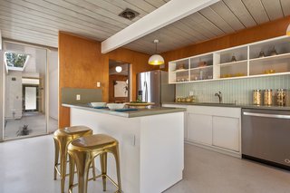 The updated kitchen is now home to a cozy breakfast bar.