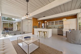 The kitchen is now bright and airy, thanks to the central atrium and the open-plan design. 