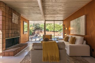 There is also a more formal living room, which features a fireplace. 