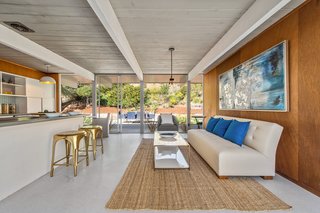 The ceilings have been painted white to create a more expansive sense of space. 