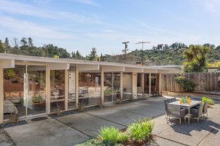 A wall of windows lines the rear of the home, allowing for even more natural light. 