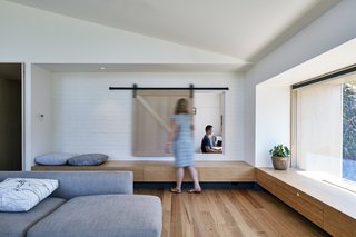 A low wooden bench running along both sides of the extension is both functional and attractive.
