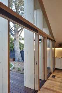 The wood was simply stained and left in its natural state, which reduced the need for more costly structural steel.