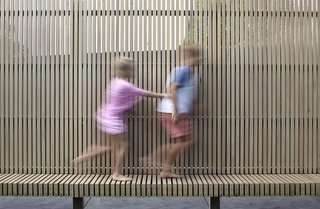 A fence at the rear adds privacy and ties into the contemporary profile of the new extension. 