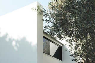 Rent This Modular Micro Cabin For Your Next Grecian Getaway - Photo 2 of 13 - Modular concrete panels make up the walls, while clerestory windows help keep the interiors bright and airy. 