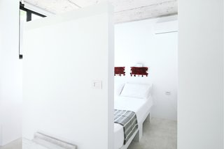 Rent This Modular Micro Cabin For Your Next Grecian Getaway - Photo 5 of 13 - The crisp white kitchen opens to the bedroom. 