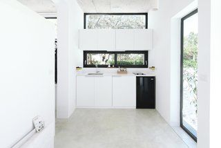 Rent This Modular Micro Cabin For Your Next Grecian Getaway - Photo 3 of 13 - A look at the tiny kitchen. The Monocabin comes with a table, which can be used either inside or outside for al fresco dining. 