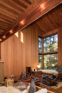 The high ceilings and glazing bring the outside in and further strengthen the home's sense of place. 