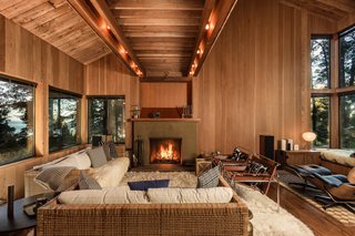 Old growth Redwood and Douglas fir interiors, combined with large picture windows, convey a sense of unity with nature throughout the living space.